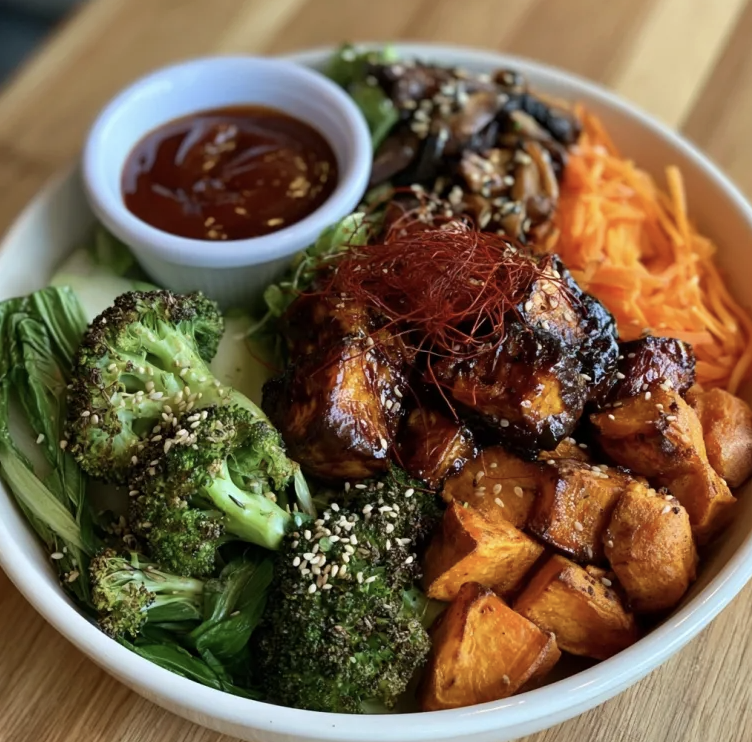 Seoul Nourish Bowl with Bulgogi Tofu, Roasted Sweet Potato, Sesame Roasted Broccoli, Bok Choy, Carrots, Mushrooms, Sesame Seeds, Chili Strands, Bulgogi Sauce