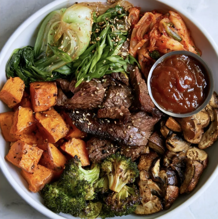 Probiotic Iron Bowl with Korean Bulgogi Steak, Roasted Sweet Potatoes, Broccoli, Mushrooms, Bok Choy, Kimchi, Scallions, Sesame Seeds, Korean Bulgogi Sauce