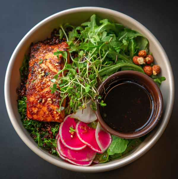 Glow Bowl with Raspberry Balsamic Salmon, Amaranth, Arugula, Asparagus, Brussels Sprouts, Hazelnut, Watermelon Radish, Berry Balsamic Glaze