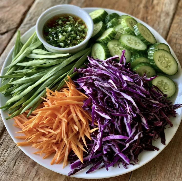 For Pros: Square Fare Plate of Square Fare Plate of Shredded Red Cabbage, Shredded Carrots, Sliced Cucumber, Raw Asian Long Bean, Vietnamese Lime Dressing Lime Dressing