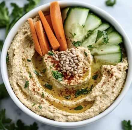 Homemade Hummus with Sunflower Seeds and Freshly Cut Veggies