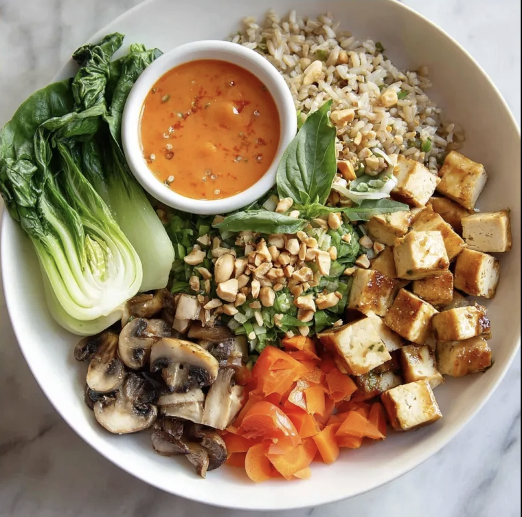 Bangkok Street Bowl with Lemongrass Coconut Tofu, Brown Rice, Mushrooms, Carrots, Bok Choy, Thai Basil, Peanuts, Tomato Cilantro Garlic Sauce