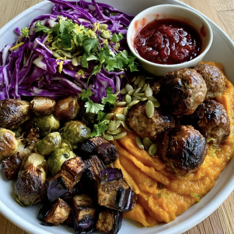 For Pros: Cranberry Harvest Glow Bowl with Cranberry Balsamic Turkey Meatballs, Butternut Squash Purée, Eggplant, Brussels Sprout, Cabbage, Cilantro, Pepita, Lime Zest, Cranberry Balsamic Glaze