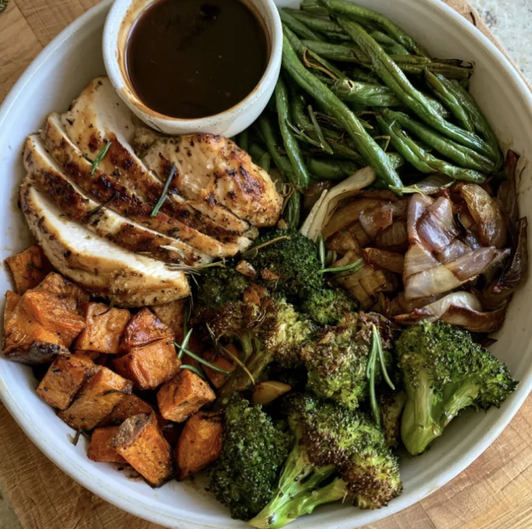 Vital Recovery Bowl with Rosemary Lemon Chicken, Roasted Sweet Potato, Broccoli, Caramelized Onions, String Beans, Sautéed Garlic, Rosemary, Blackberry Balsamic Dressing