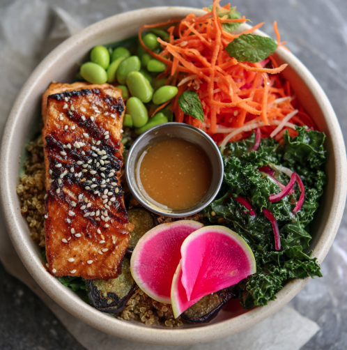 Harvest Bowl with Miso Glazed Salmon, Quinoa, Japanese Eggplant, Shredded Carrot, Kale, Edamame, Sesame Seeds, Shiso, Watermelon Radish, Miso Sesame Glaze