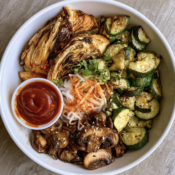 Square Fare Plate of Roasted Napa Cabbage, Roasted Zucchini, Pickled Daikon Noodles, Sautéed Button Mushrooms, Korean BBQ Sauce