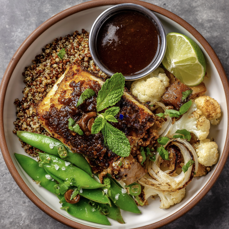 For Pros: Tamarind Omega Bowl with Smoky Tamarind Barramundi, Sorghum, Roasted Cauliflower, Roasted Turnips, Caramelized Onions, Steamed Snap Peas, Mint, Lime Wedge, Smoky Tamarind Glaze