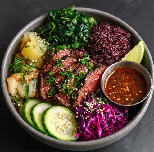 For Pros: Korean Bulgogi Bowl With Tamari–Gochugaru Steak, Purple Rice Berry, Roasted Cabbage, Spinach, Cucumber Kimchi, Scallions, Lime Wedge, Sesame, Bulgogi-Style Sauce