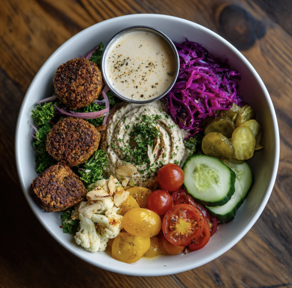 For Pros: Levantine Vitality Bowl with Falafel, Hummus, Cauliflower, Baba Ghanoush, Cucumber, Tomatoes, Cabbage, Romaine, Parsley, Sunflower Seeds, Cornichon, Tahini Sauce