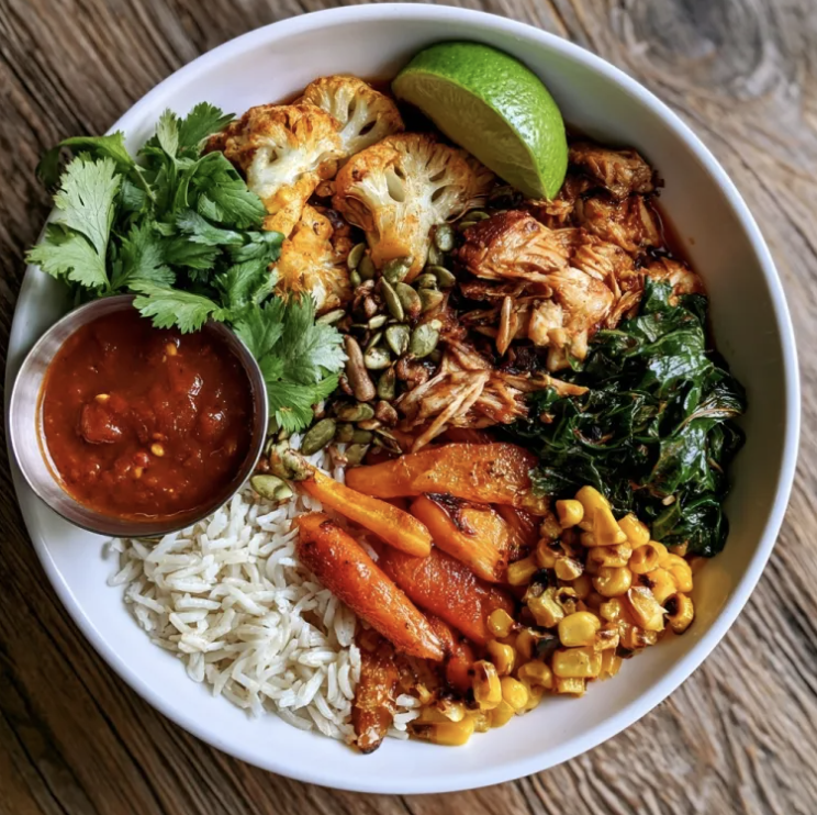 For Pros: Tamarind Sunset Bowl with Smoky Tamarind Shredded Chicken, Basmati Rice, Cauliflower, Carrots, Braised Collard Greens, Cilantro, Lime, Pepitas, Tamarind Tomato Sauce