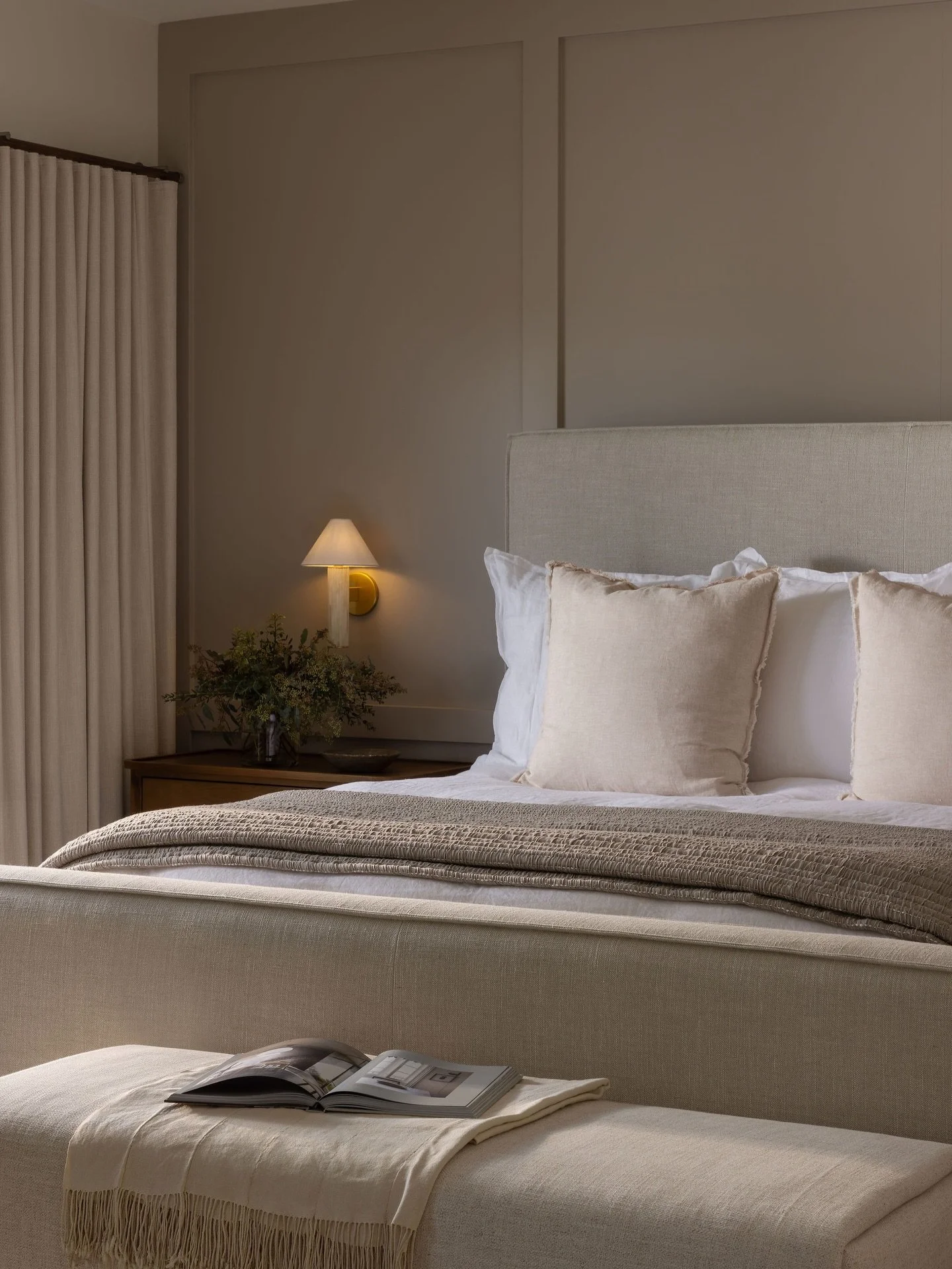 A primary suite I feel we can all appreciate 🤍
The layered materials and the blended natural materials is my favorite. Intentional mix of wood, marble surround fireplace, subtle wall molding, warm wall tone , &amp; soft upholstery. 👌🏼

Design | @k