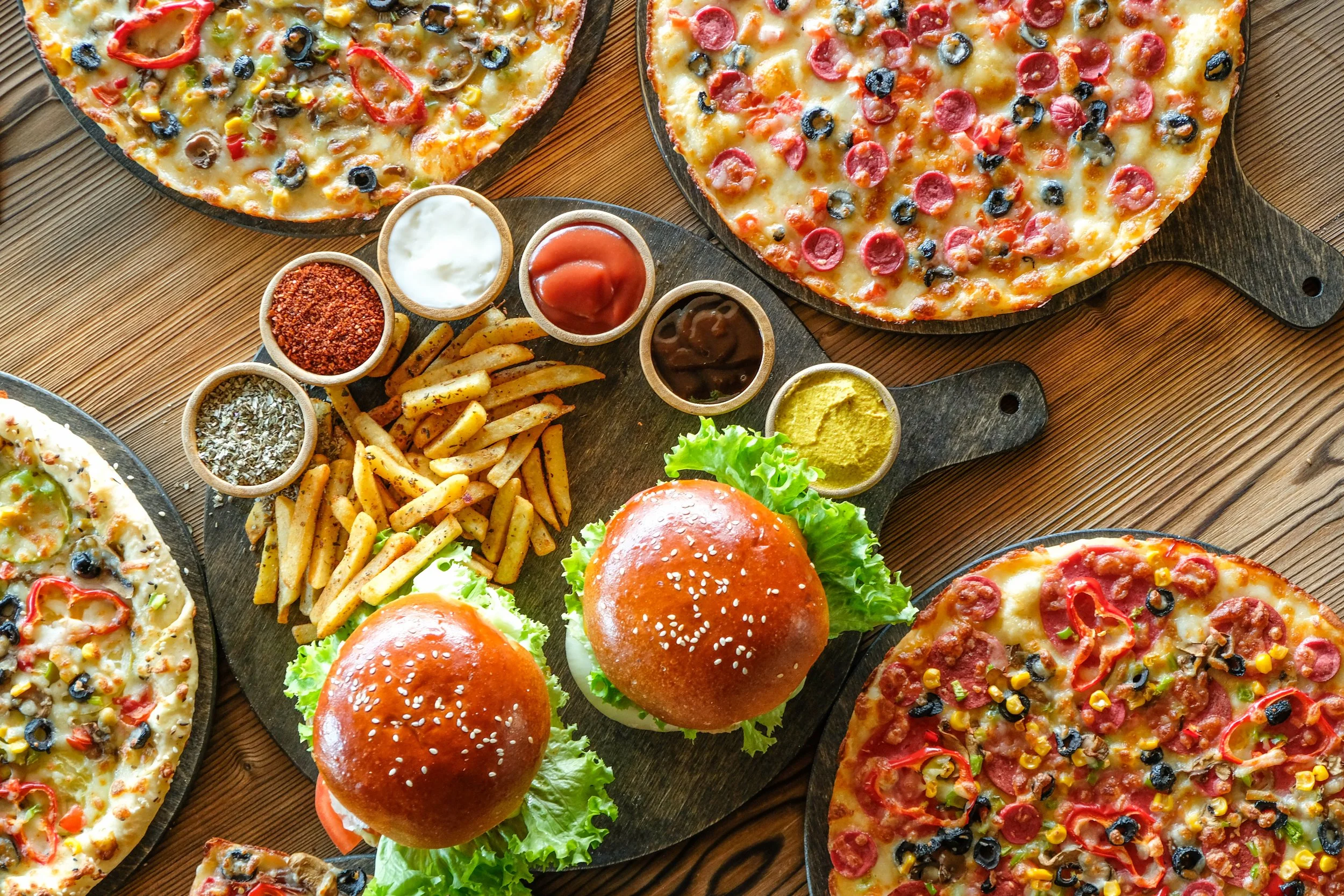 top-view-picture-a-variety-of-burgers-pizaa-and-f-2024-11-10-01-47-23-utc.jpg