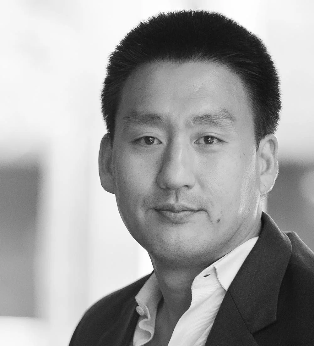 Greyscale portrait photo of John Shin