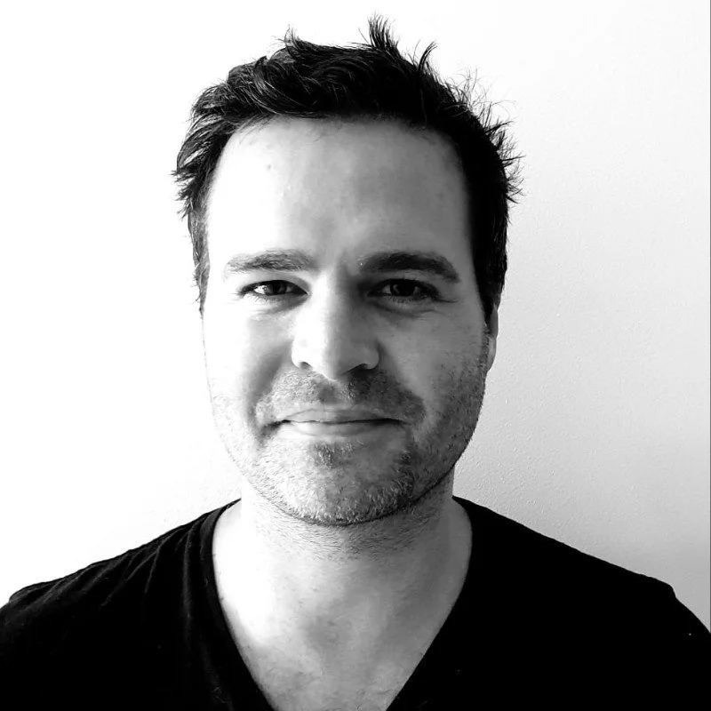 Greyscale portrait photo of Alex Gale