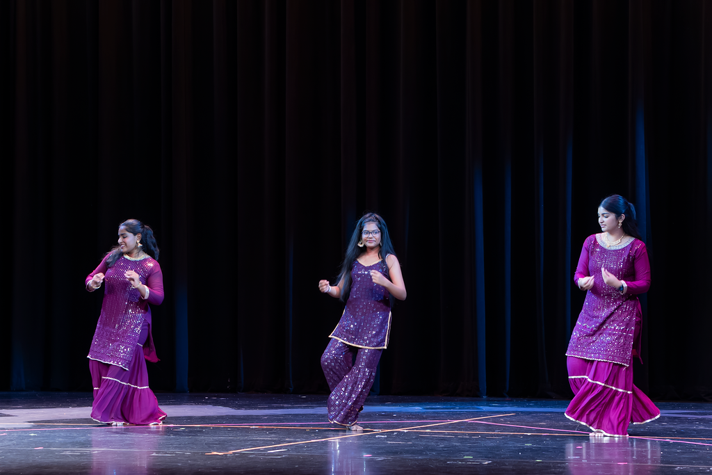 Bollywood pre-teen dance class performing confidently under stage lights at Spring Recital