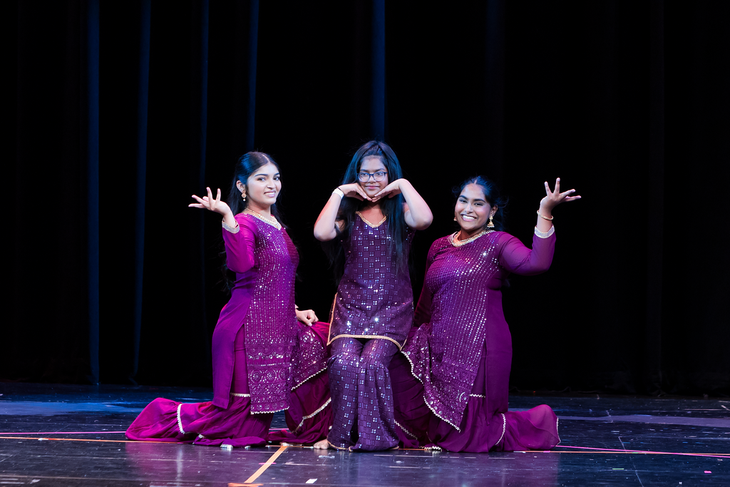Pre-teen performing a Bollywood dance routine on stage during the Fall Recital