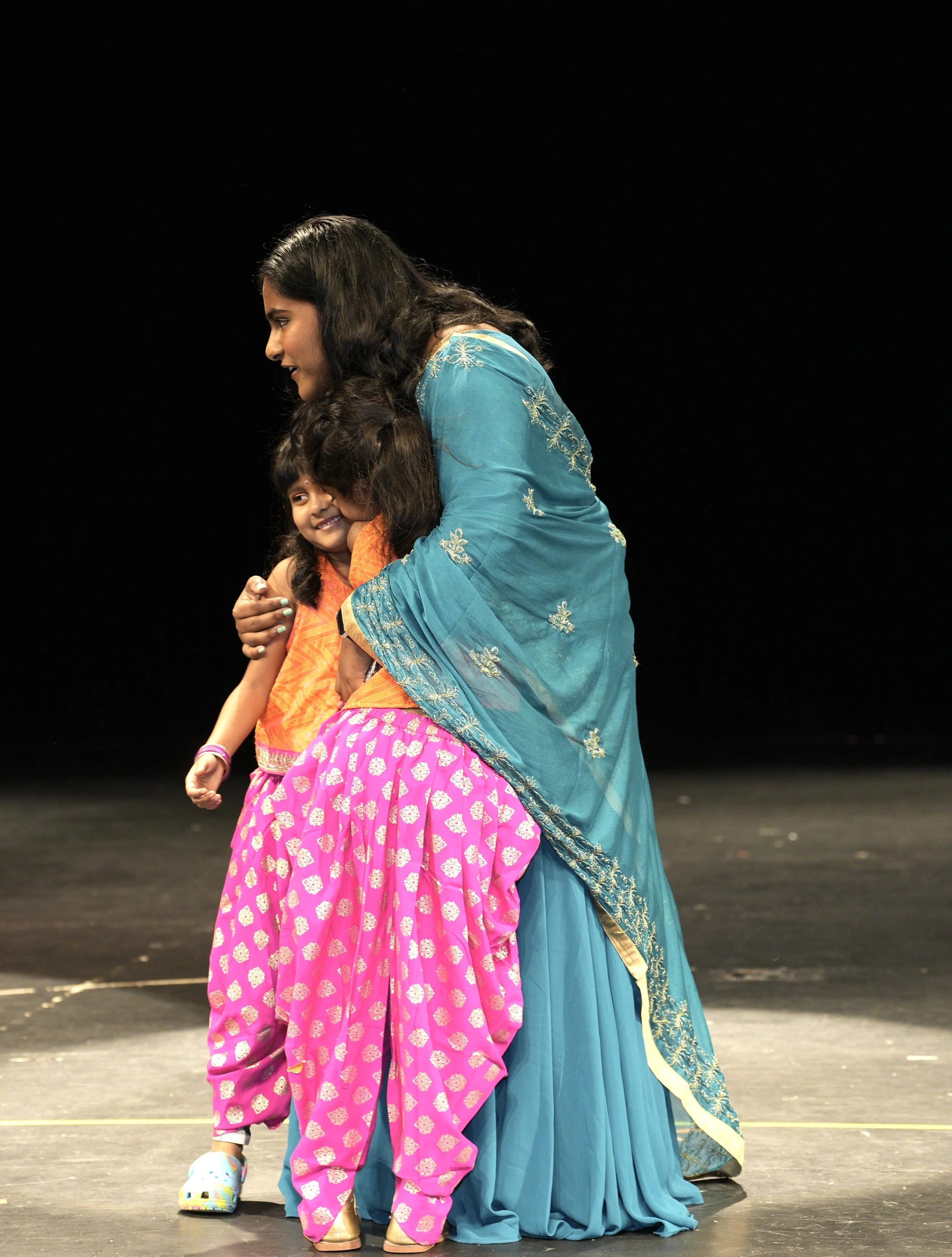 Group of children performing Bollywood choreography fall recital