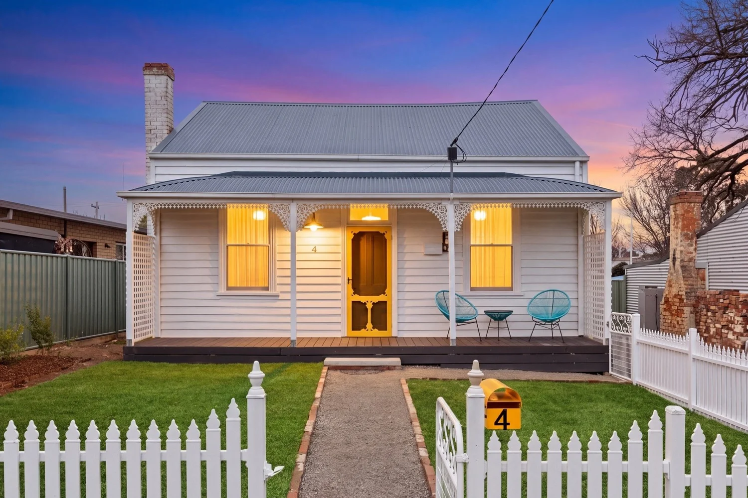 Front exterior of 4 Casey Street converted to dusk with warm interior lighting