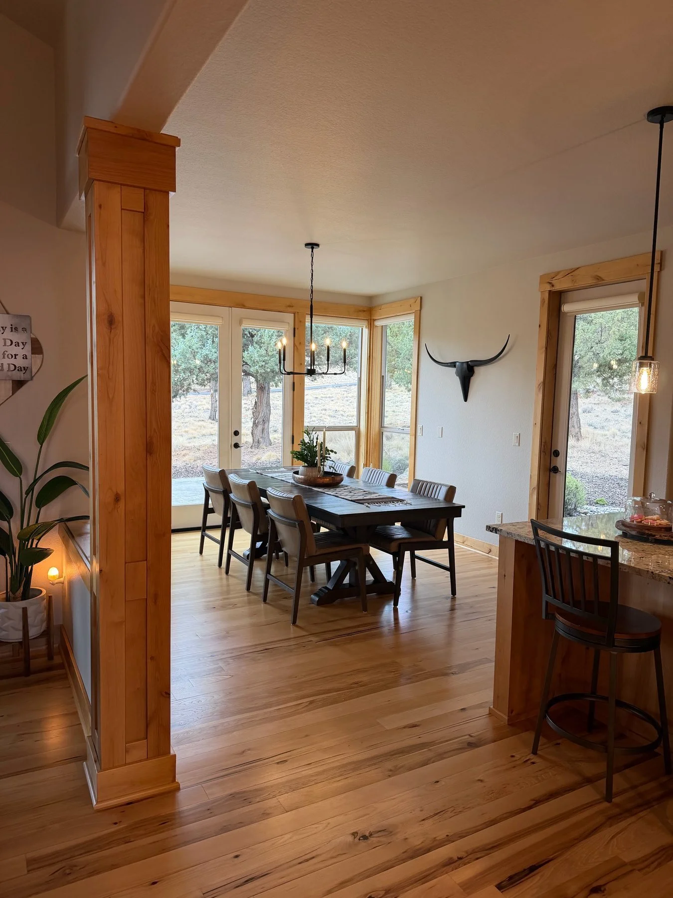 Eaglecrest dining room with light walls, wood trim, and Central Oregon views after interior painting