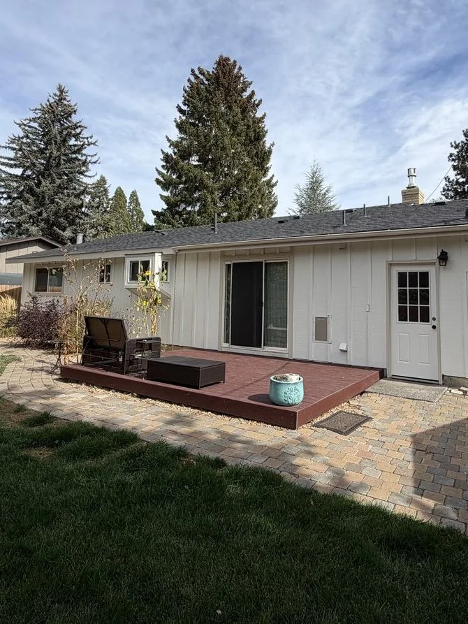 Back of a Bend home with deck after exterior painting in Alabaster with Accessible Beige trim