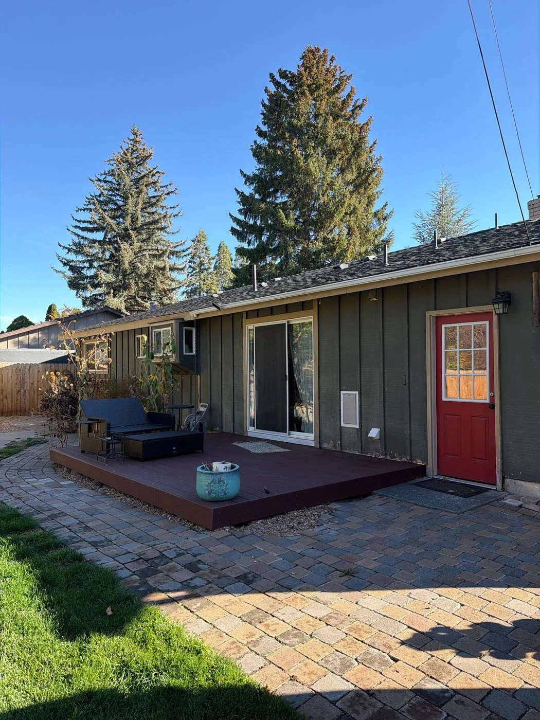Back deck of a green Bend house before exterior painting