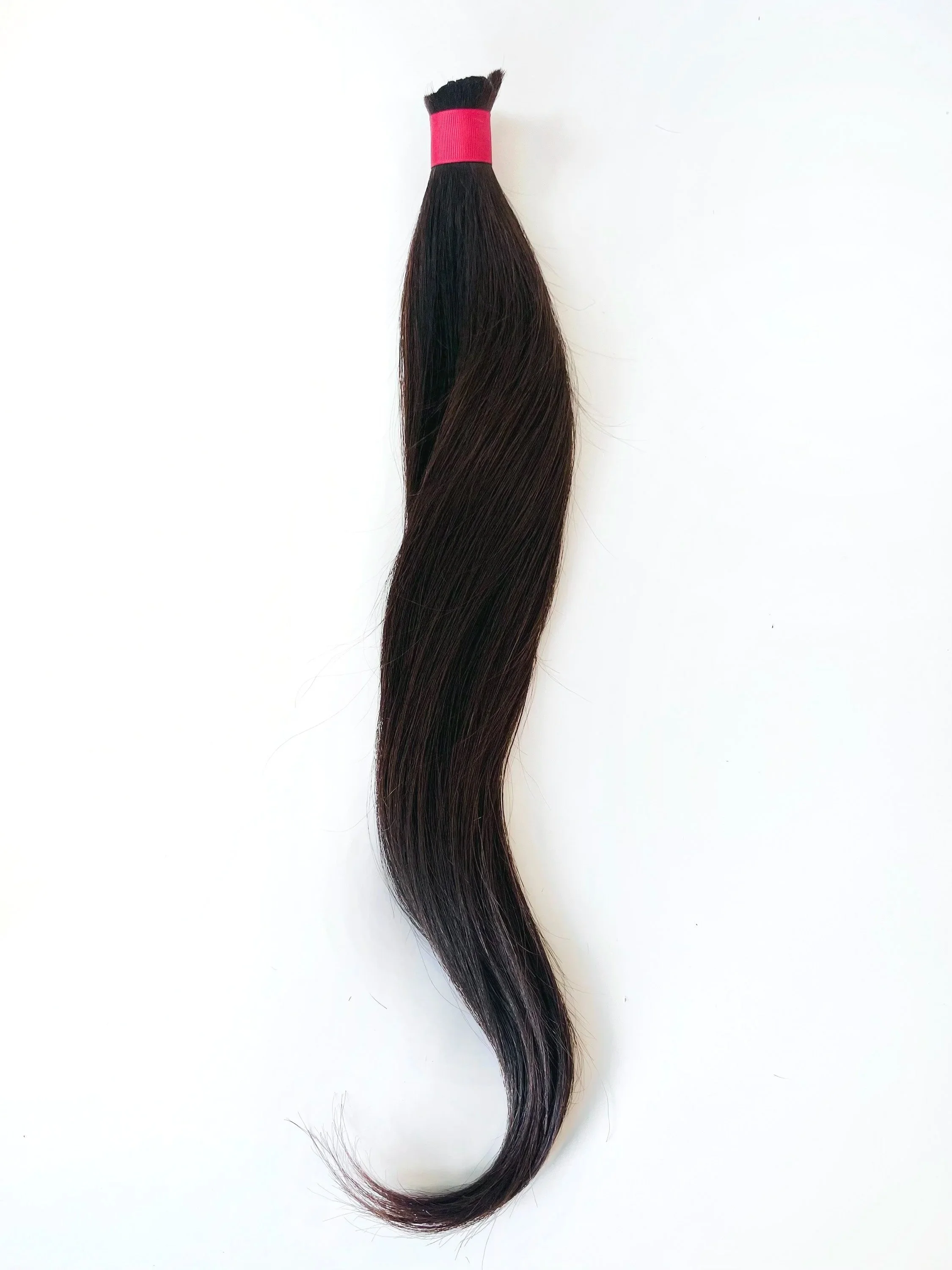 Hair 2026,
2026,
artist’s hair tied with red ribbon,
59 x 9 cm (23.23 x 3.54 in.)