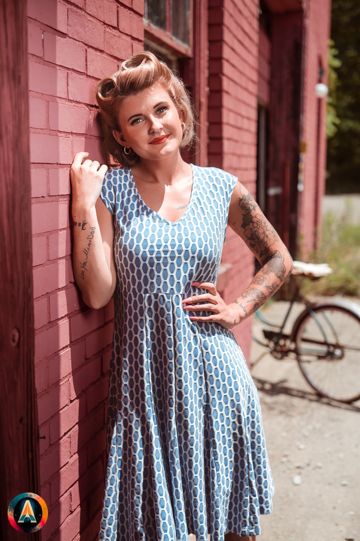 Blonde model courtney france poses in an abandoned shop / laundromat in pinup attire.