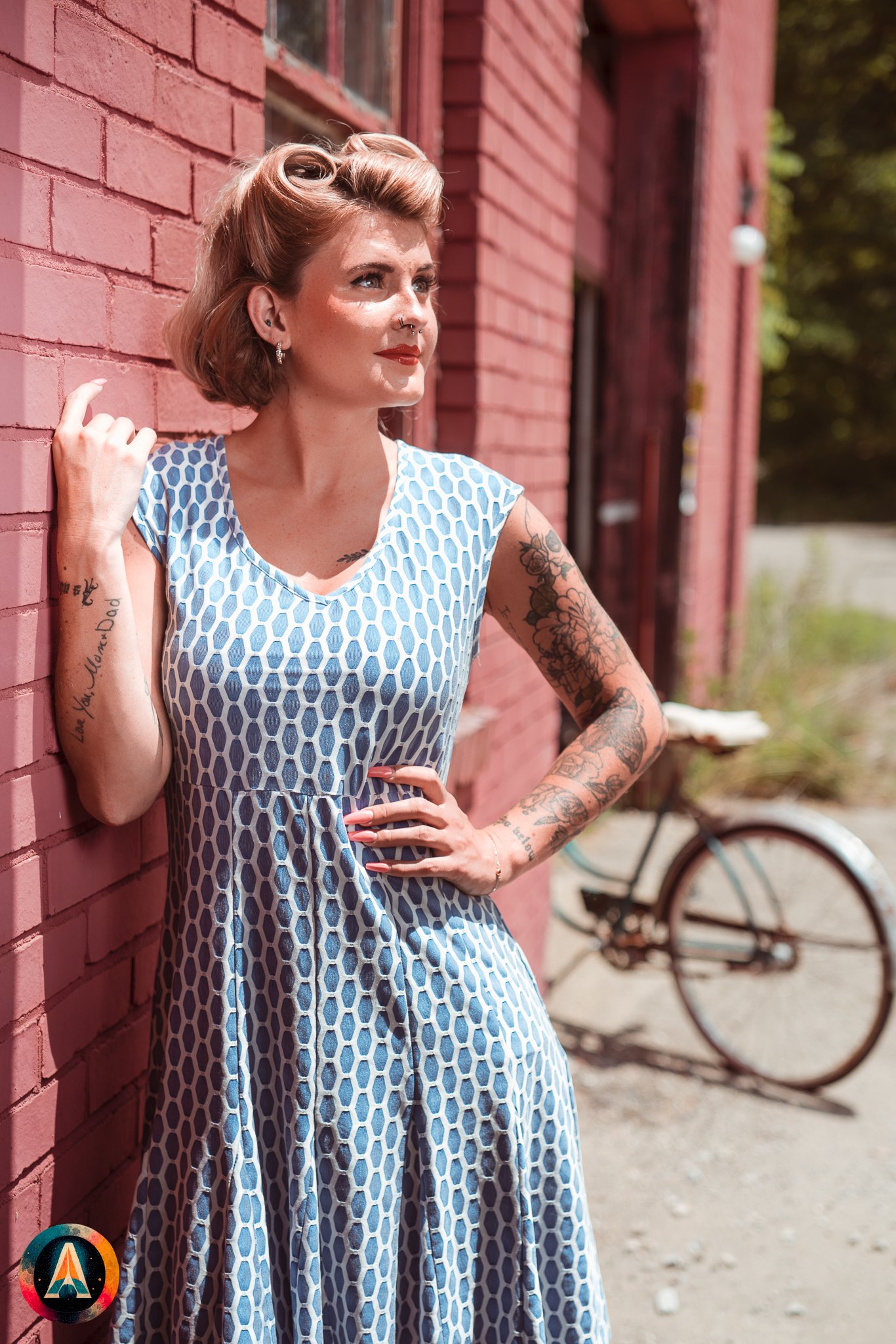 Blonde model courtney france poses in an abandoned shop / laundromat in pinup attire.