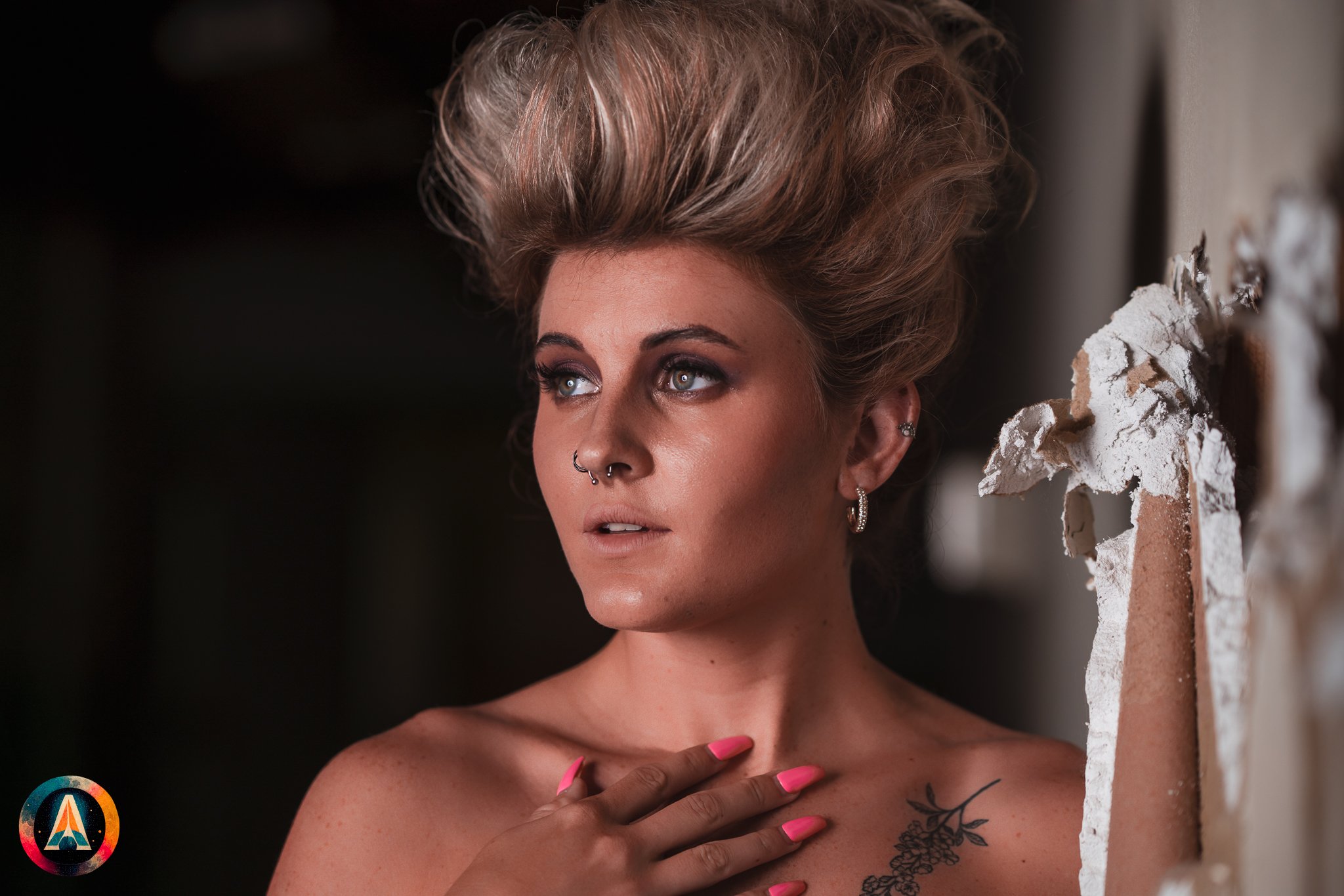 Blonde model courtney france poses in the haunted indiana state sanitarium shop / hair salon in a elegant blue dress.