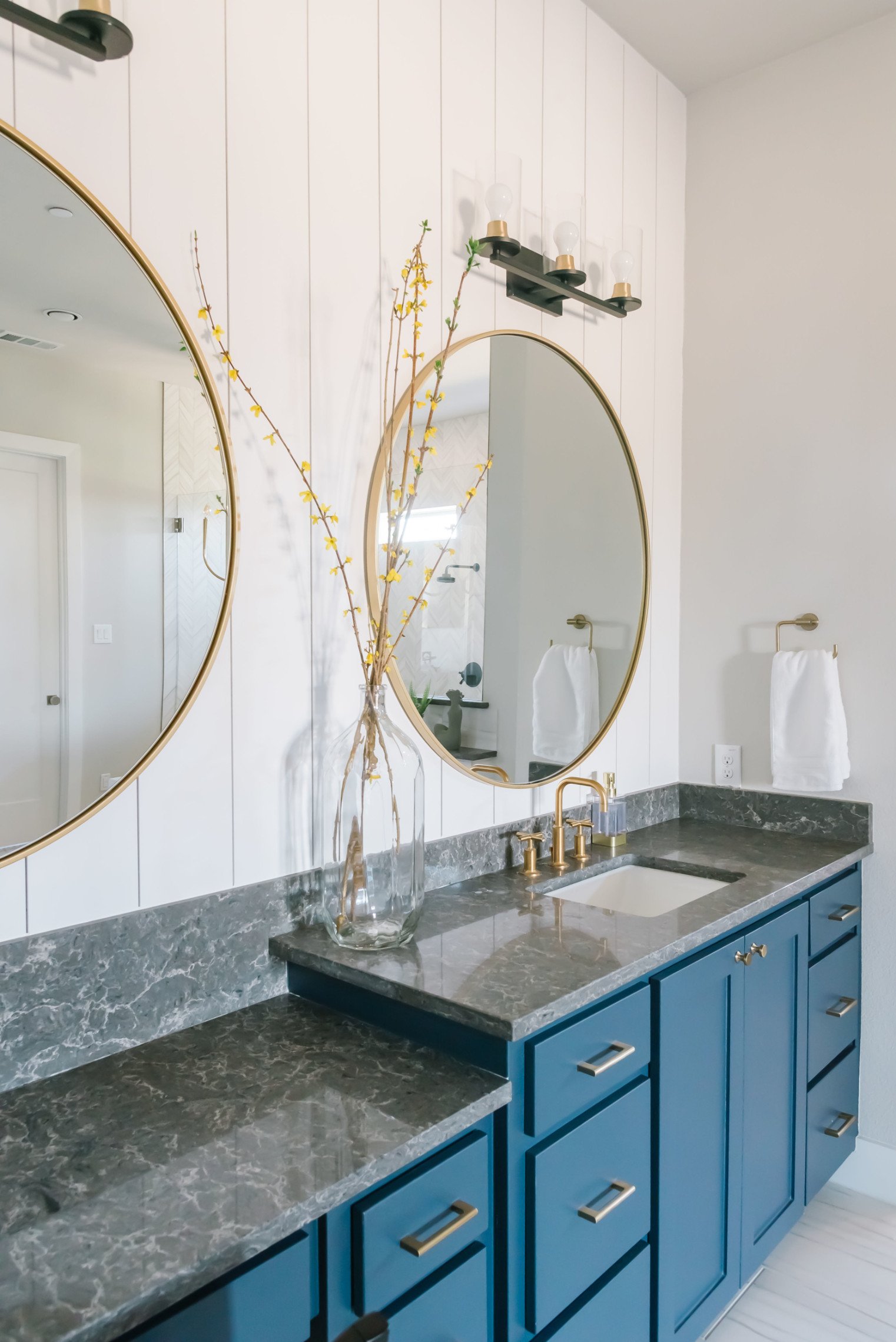Bright Bathroom with Blue Vanities by House Sprucing 2.jpg