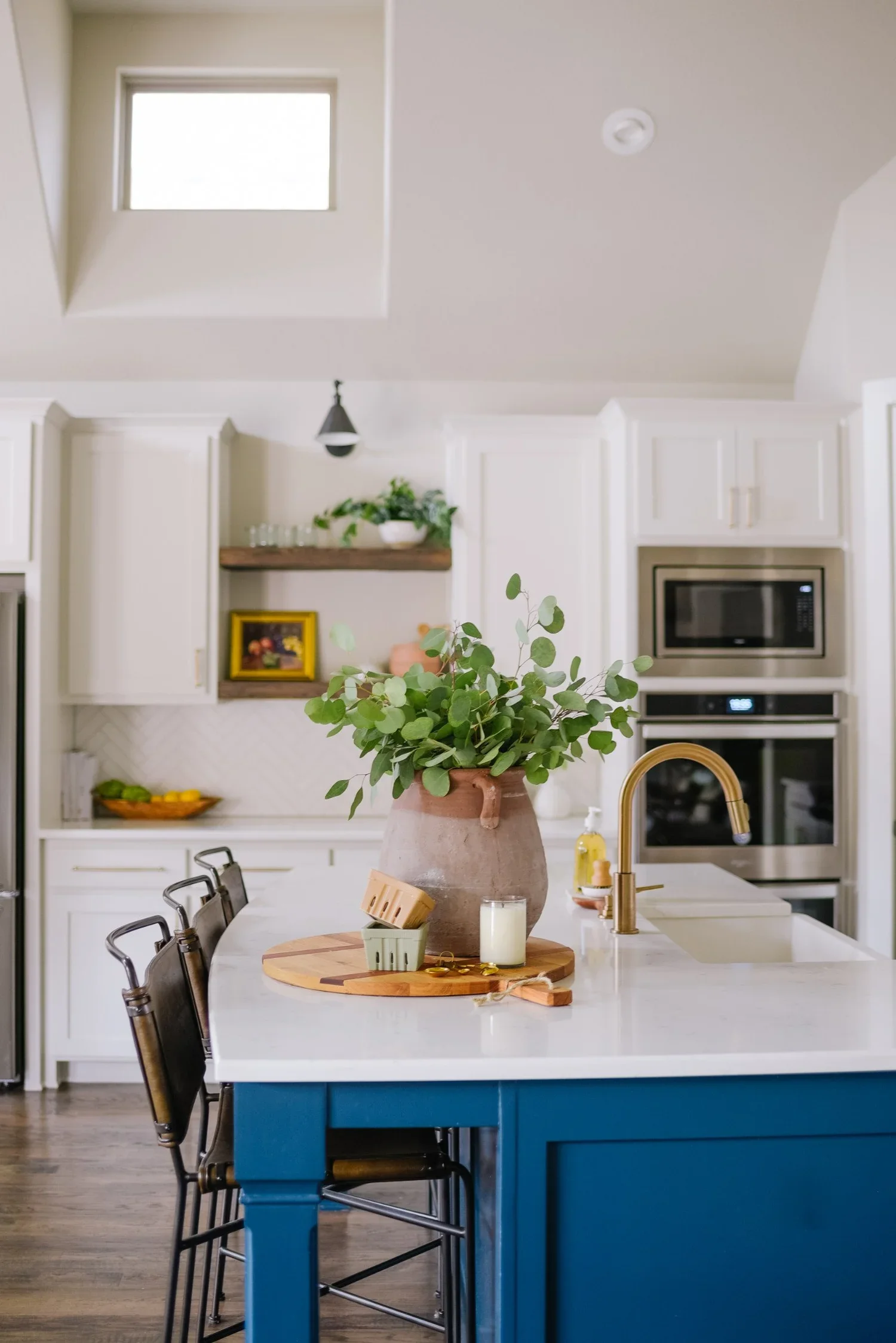 Crisp+White+Kitchen+_+Dining+with+Blue+Island+by+House+Sprucing+37.jpg.webp