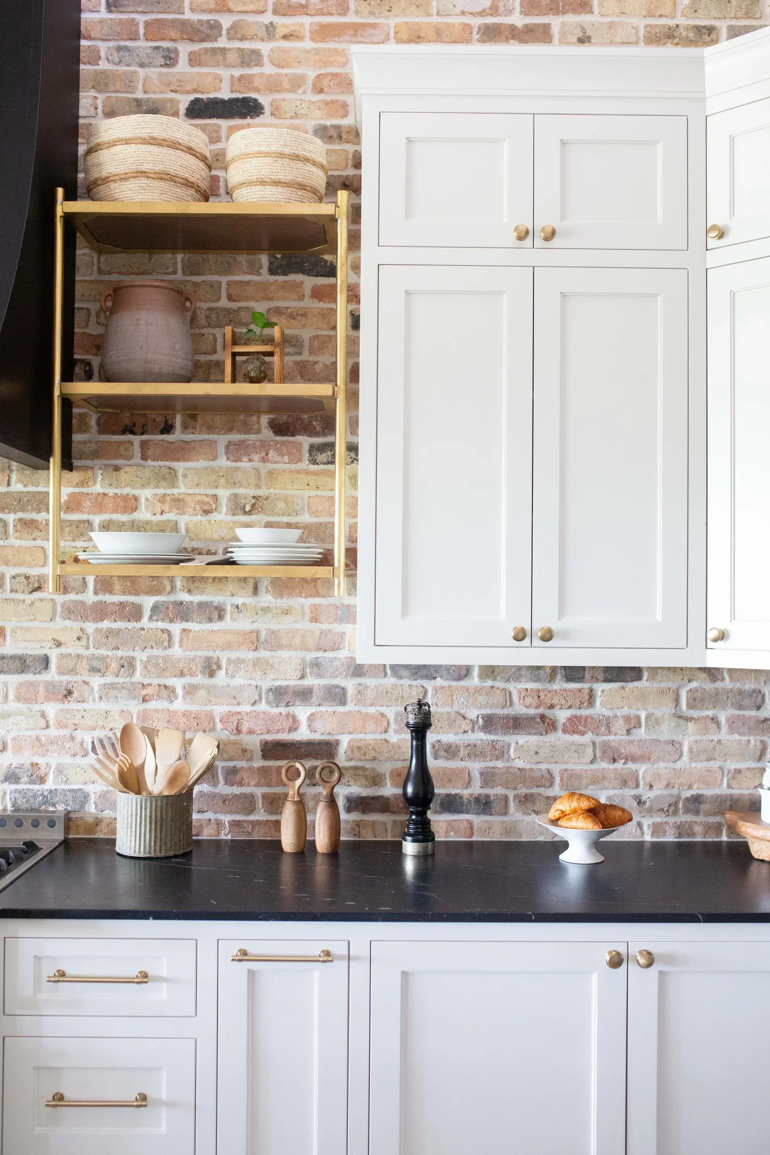 Black+_+White+Kitchen+with+Brick+and+Wood+Accents+by+House+Sprucing+32-min.jpg.webp