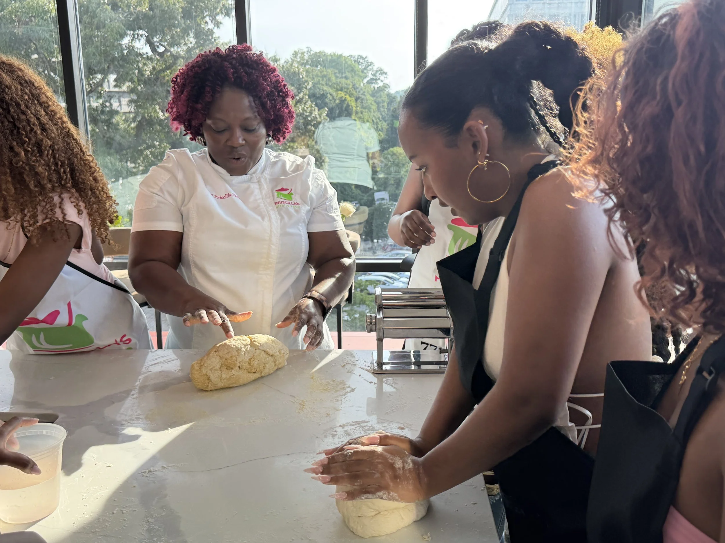 Three women in aprons, one with