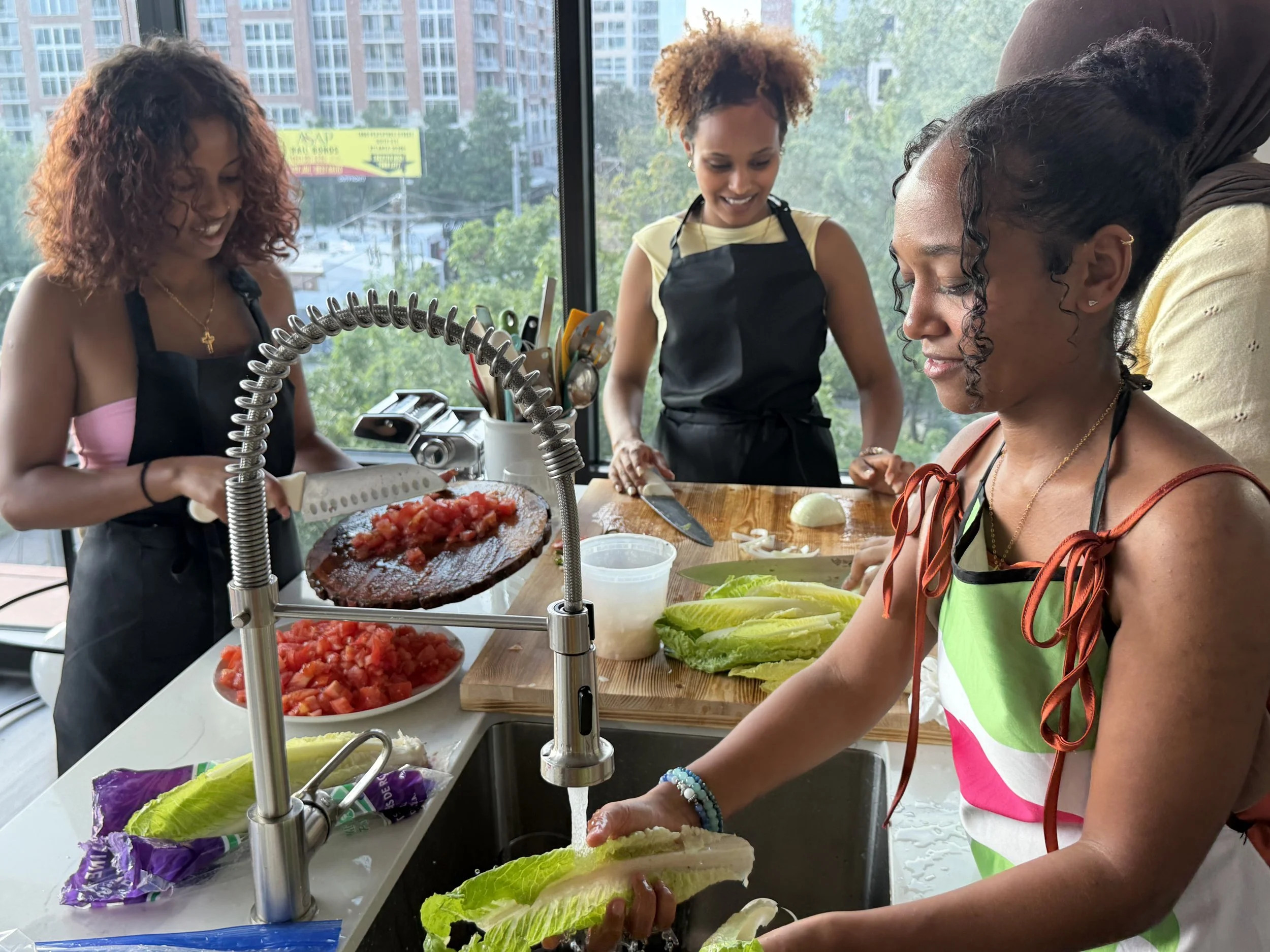 Three women in aprons, one with