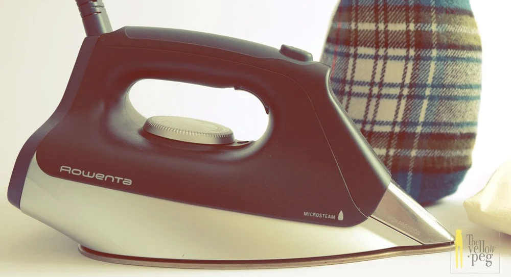 Ferro da stiro a caldaia e cuscino da sarto