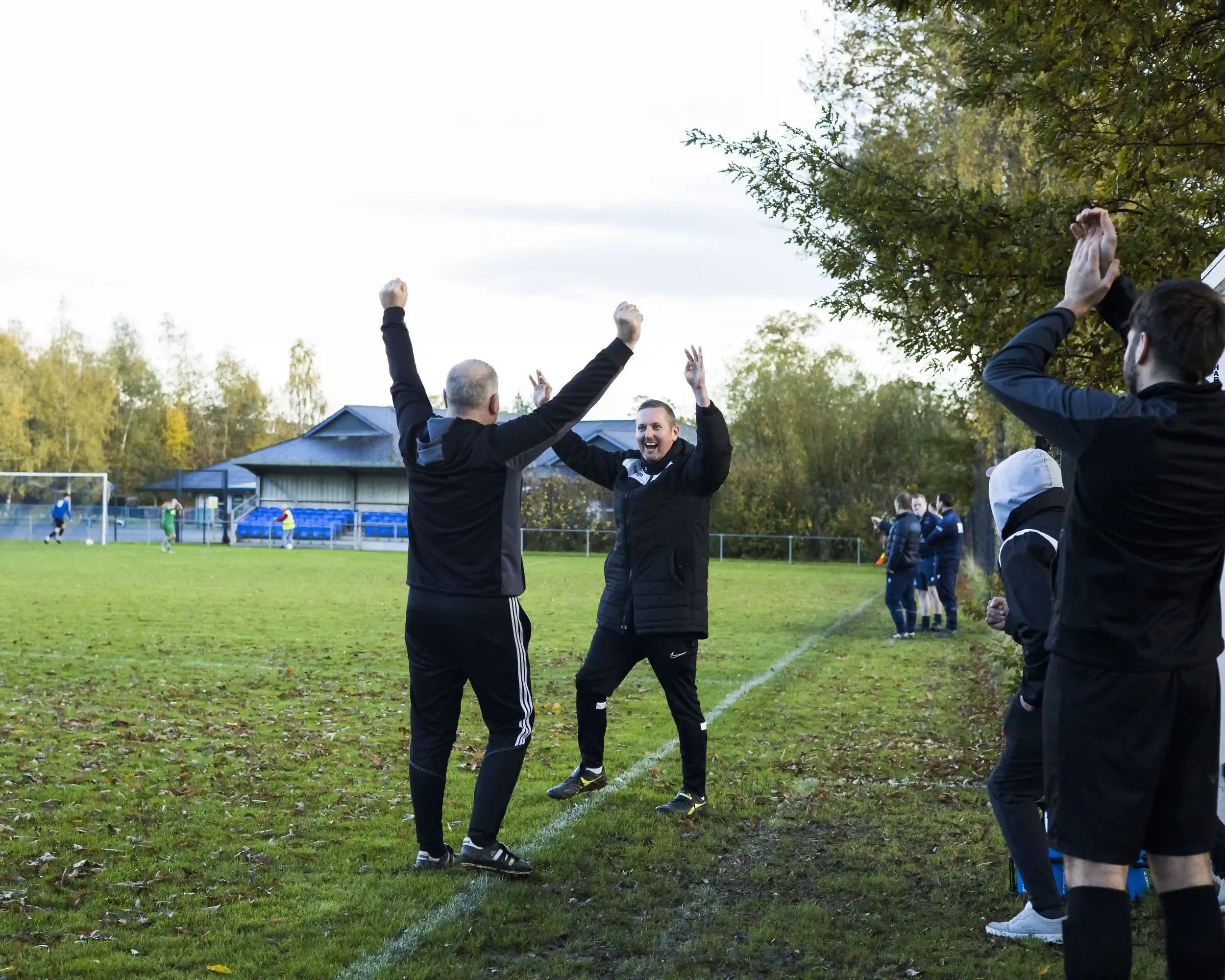 matthew-morgan-football-case-study-llanrhaeadr-coaches-celebration.webp