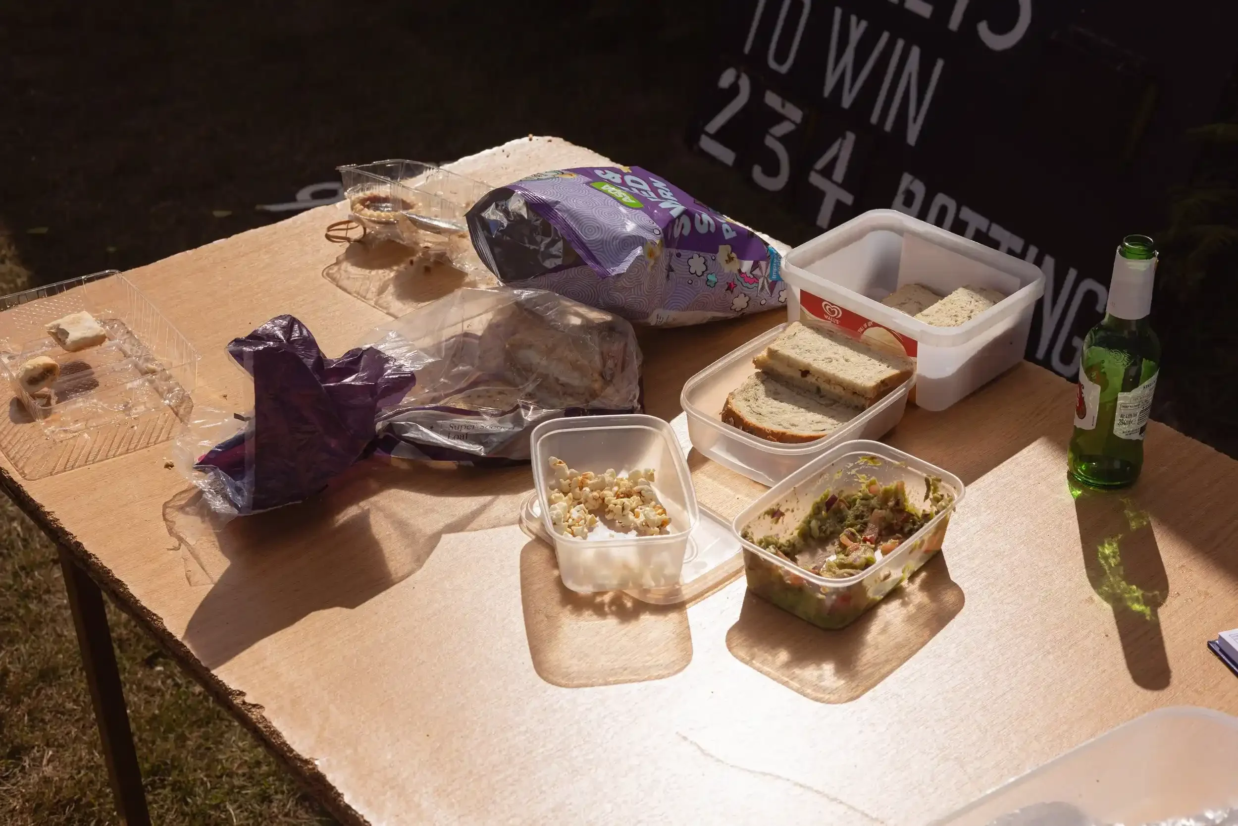 A traditional Cornish cricket tea spread with sandwiches and beer, featured in the 2026 Cricket District calendar by Matthew Morgan.