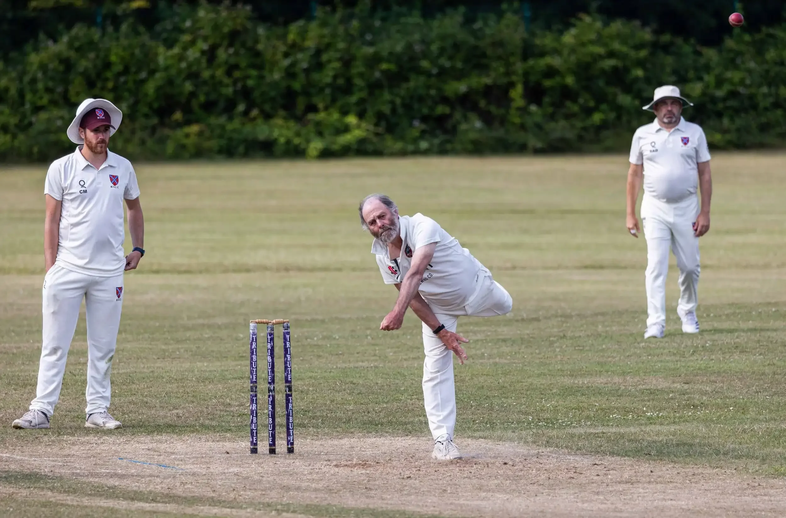 A spin bowler for the Seaview Old Boys in mid-delivery during a cricket match in Falmouth, Cornwall, captured by award-winning photographer Matthew Morgan.