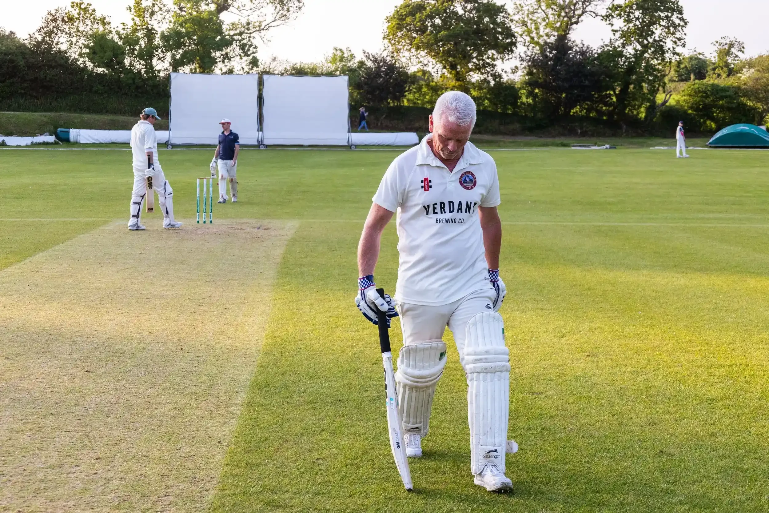 Editorial sports action shot of a Seaview Old Boys player on the pitch at Falmouth Cricket Club, Cornwall, by award-winning photographer Matthew Morgan.