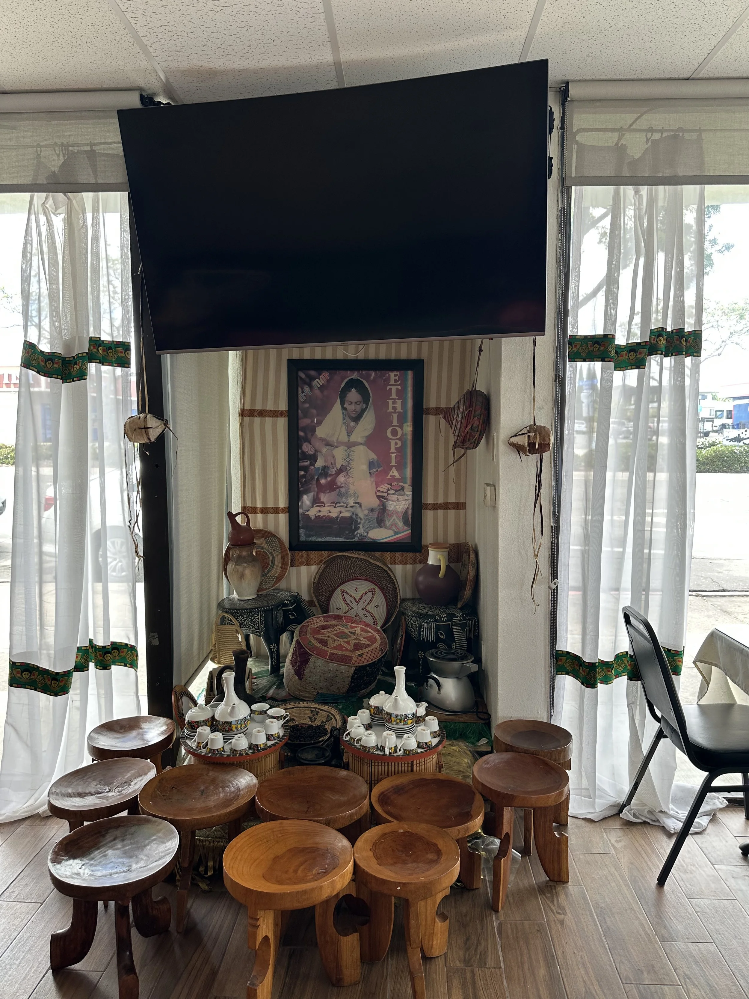 BEFORE — The coffee ceremony area was tucked in a very small nook and blocked by a large tv
