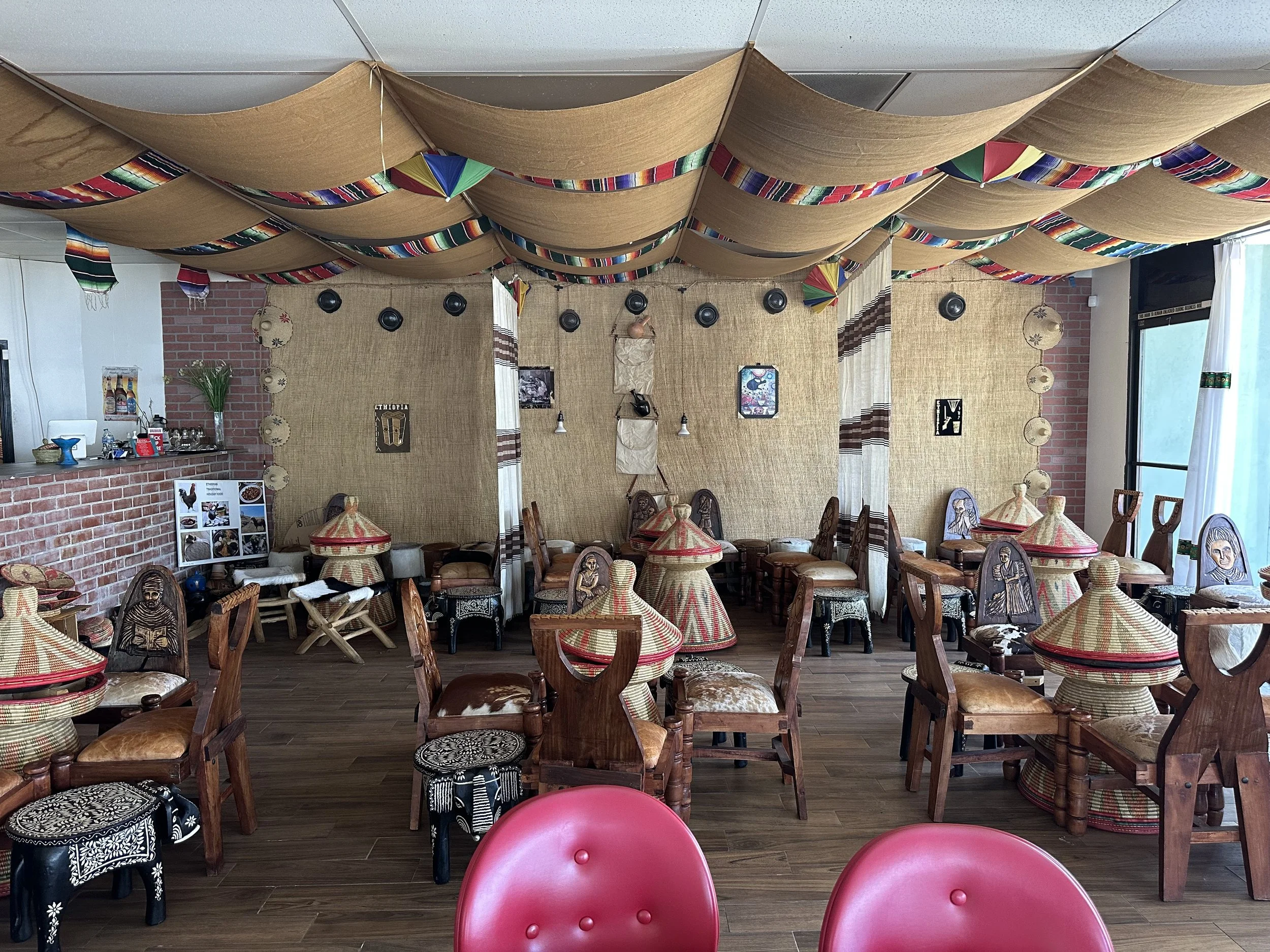 BEFORE — The traditional seating area featuring mesob tables was the highlight of the initial space