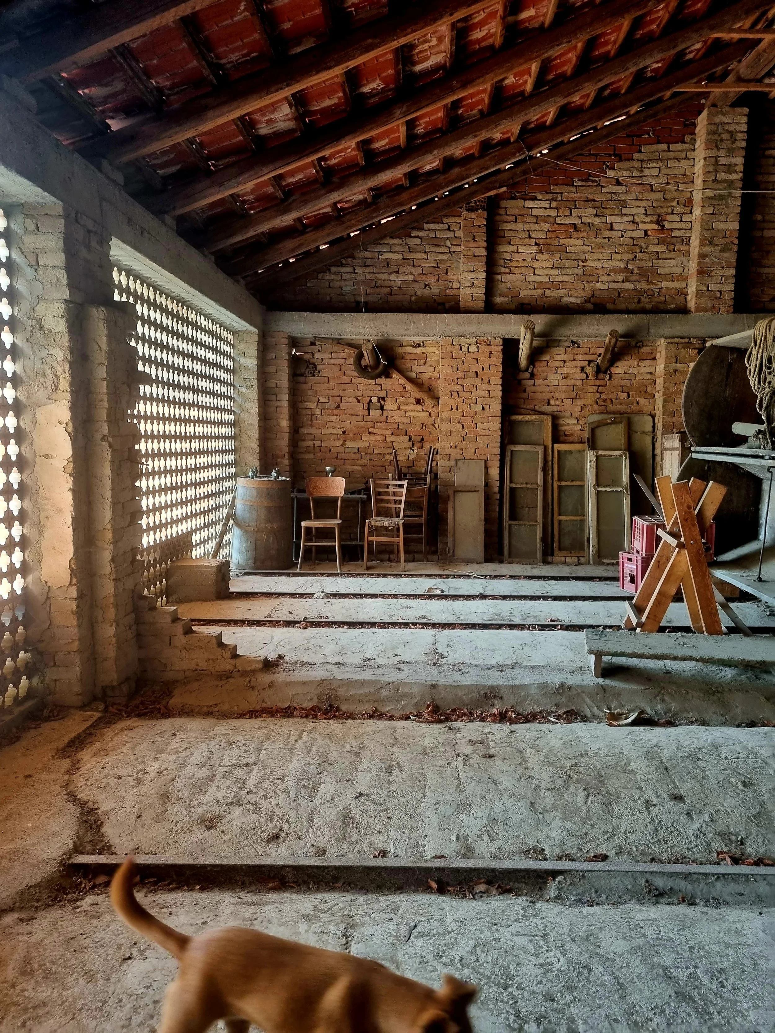 Interior of a non-habitable fienile in Piemonte showing height and window constraints for conversion to living space