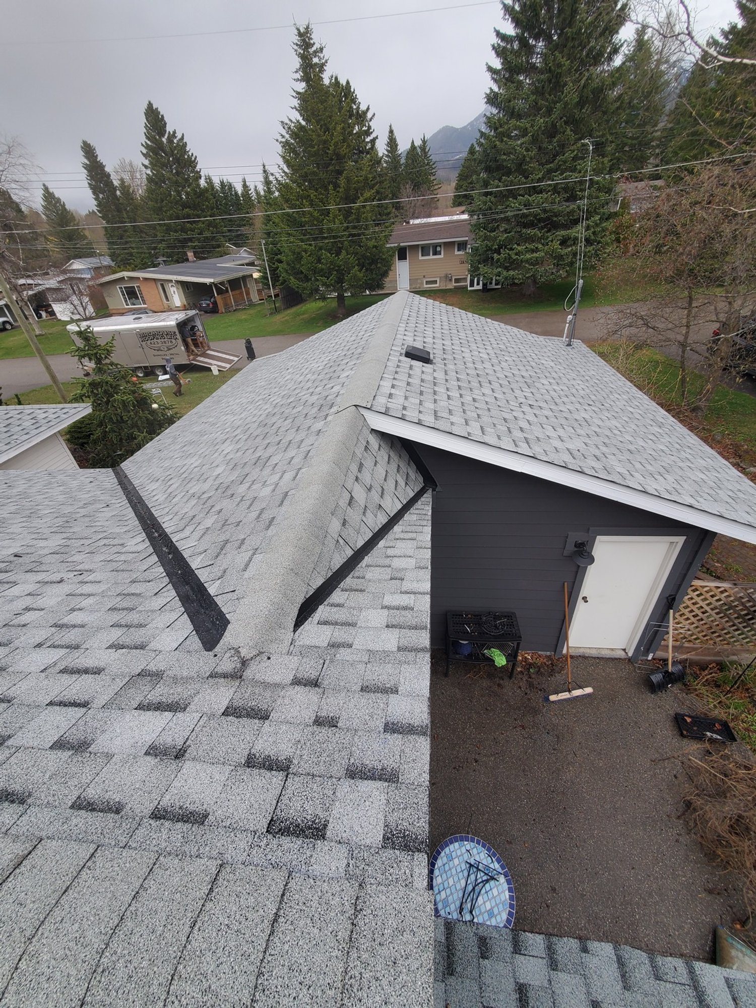 Birdhouse Roofing - After Asphalt IKO Shingles with Steel Valley Pans