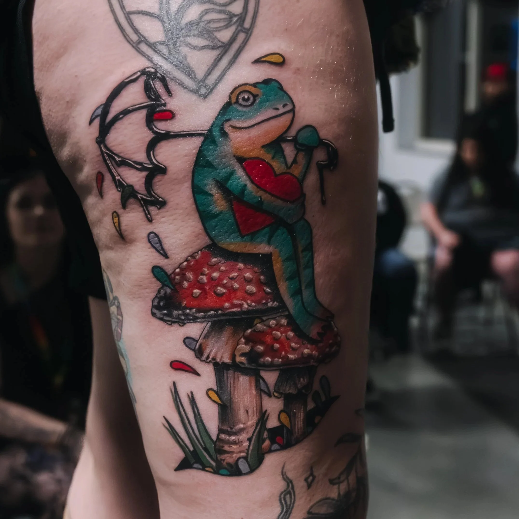 Detailed tattoo photography showing accurate color and texture on skin in a professional studio setting.