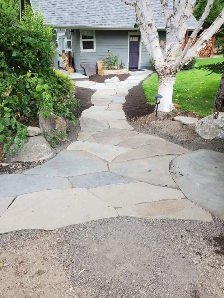 Slate patio leading to a home.
