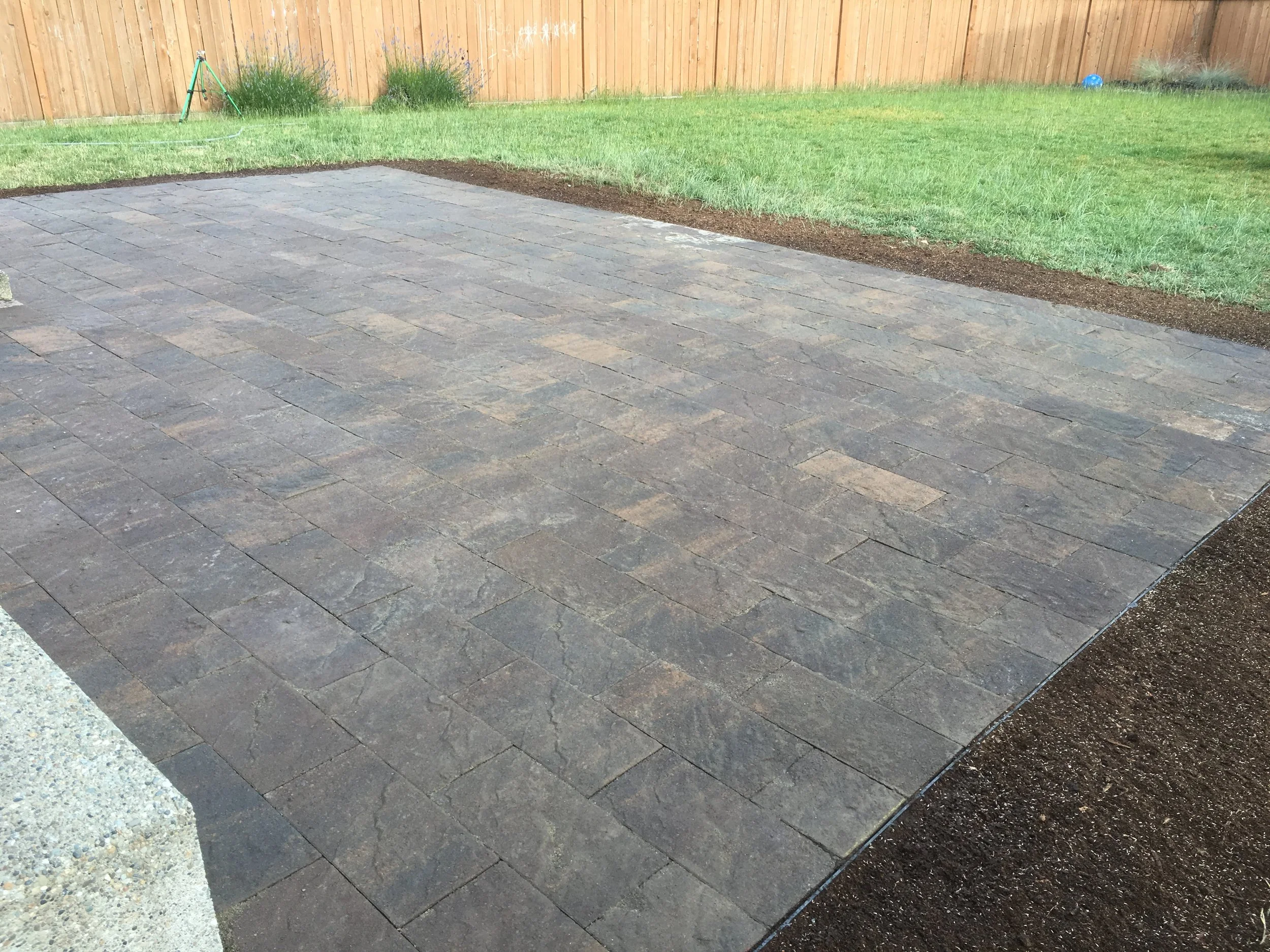 Large paver patio and lawn.