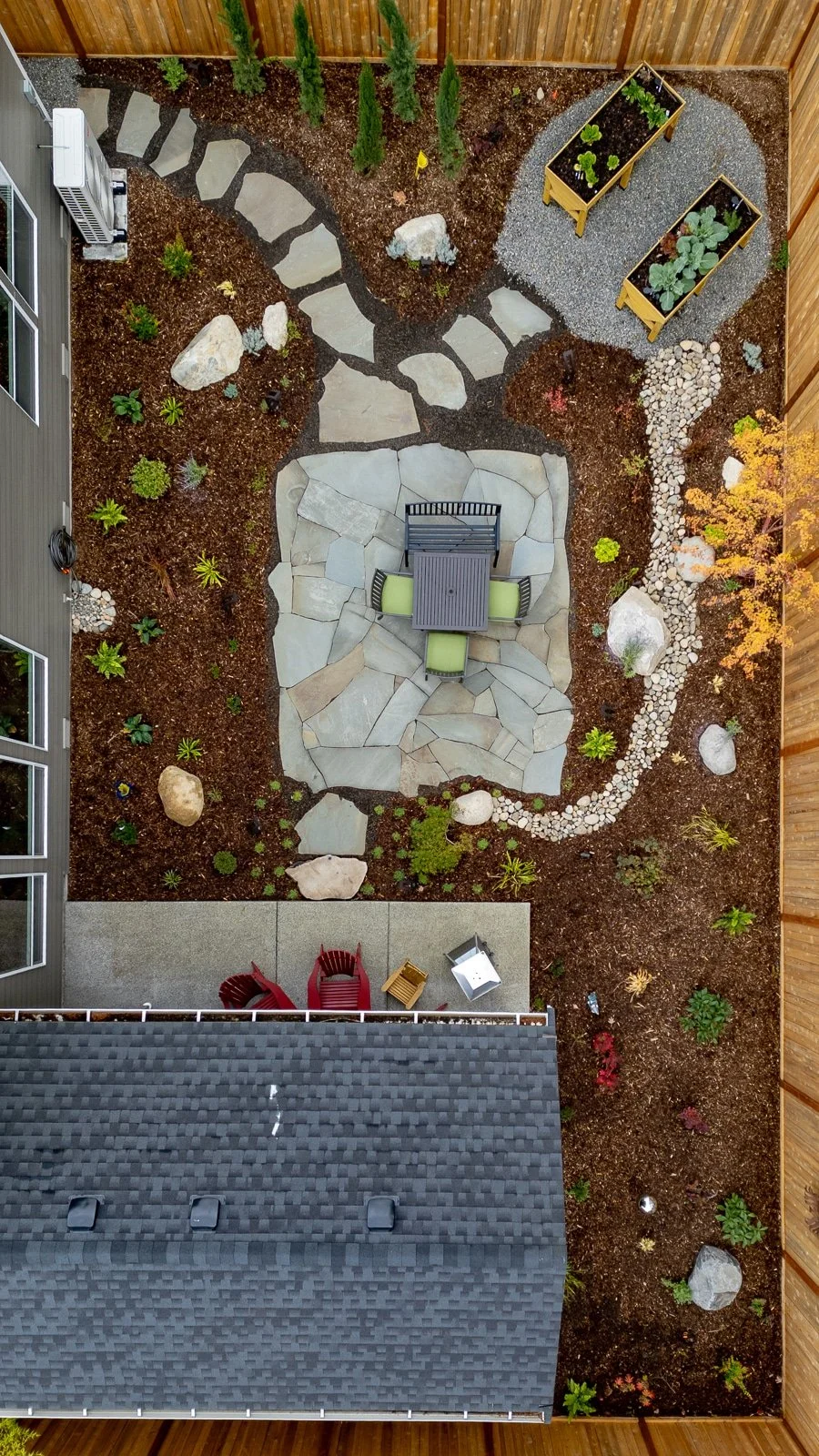 Custom slate patio with sitting area surrounded by stunning cedar fence 8.jpg