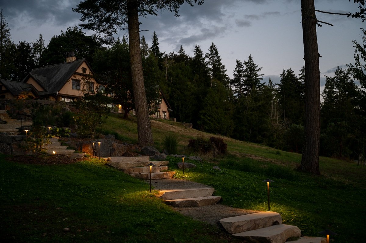 Lighted stone stairs at dusk.
