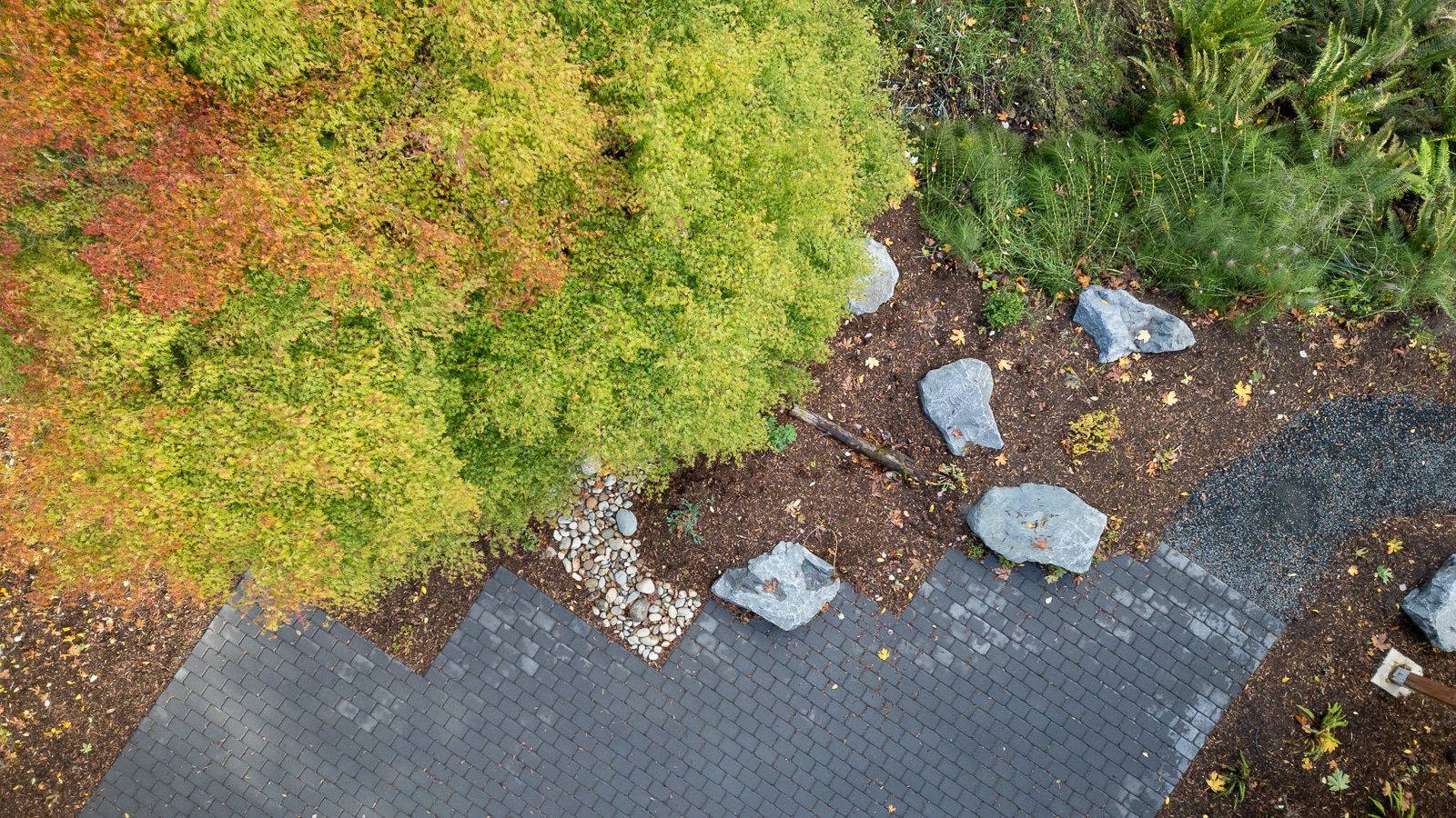 Aerial view of concrete paver patio and PNW garden scape.jpg