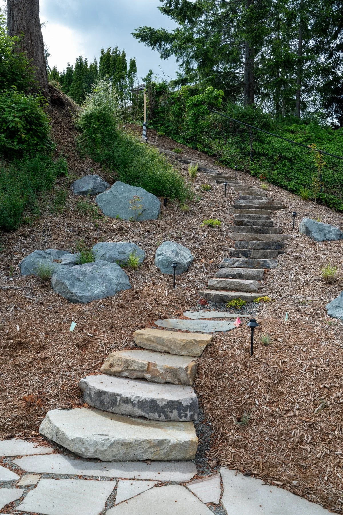 Stone stairs leading to slate patio.